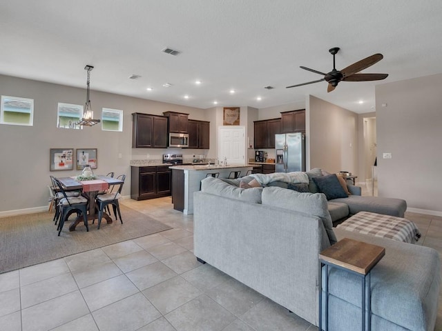 2641 Crowned Eagle Cir SW, Vero Beach, FL 32962 - living area with a ceiling fan, light tile patterned floors, a chandelier, and recessed lighting