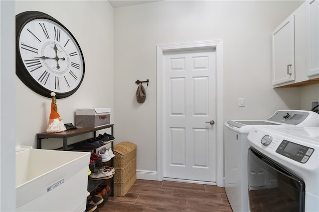 laundry room with washer and dryer, sink, and cabinets