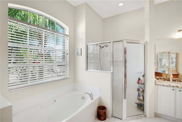 bathroom featuring separate shower and tub, tile patterned flooring, and vanity