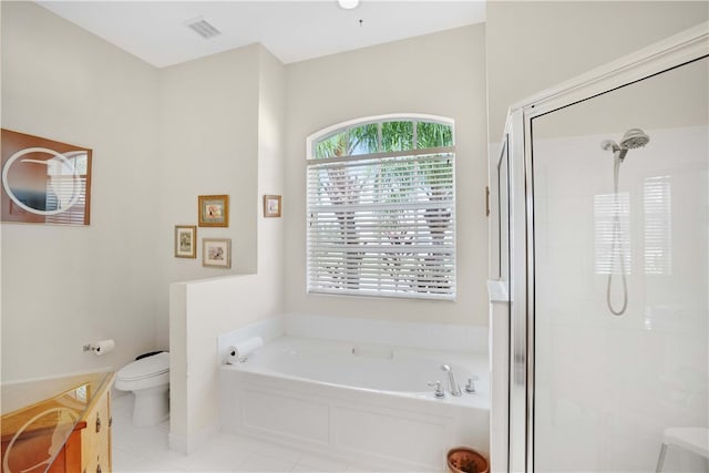 full bathroom with toilet, vanity, tile patterned flooring, and separate shower and tub