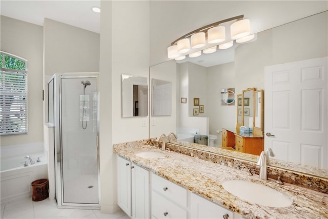 full bathroom featuring tile patterned floors, vanity, toilet, and shower with separate bathtub