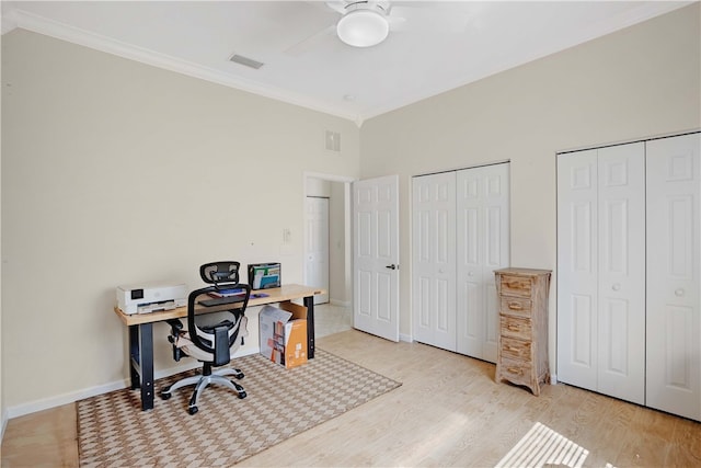 office space with ceiling fan, light hardwood / wood-style floors, and crown molding