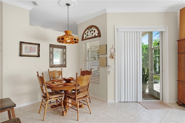 tiled dining area featuring ornamental molding