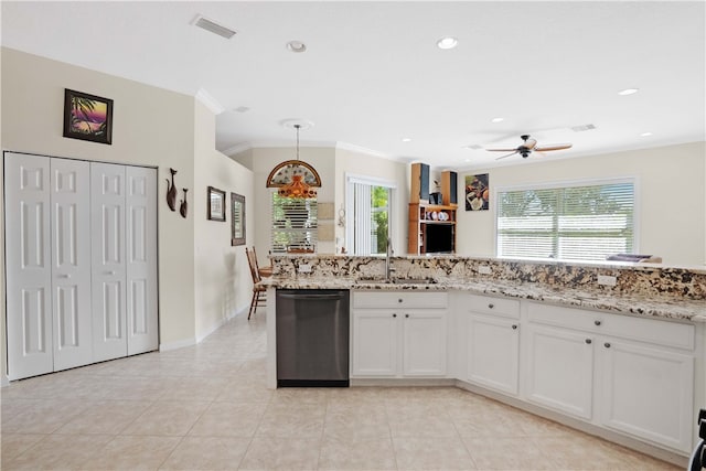 kitchen featuring dishwasher, white cabinetry, a wealth of natural light, and sink