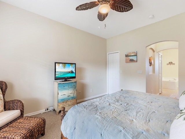 carpeted bedroom featuring a closet and ceiling fan