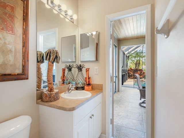 bathroom with vanity and toilet