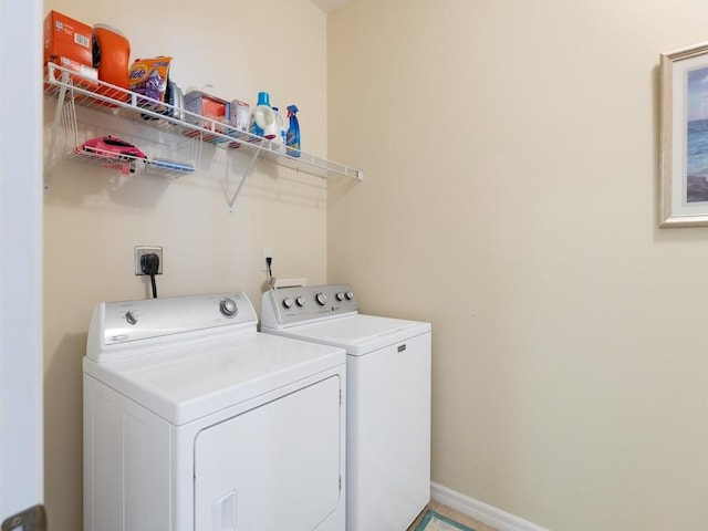 laundry area featuring washing machine and clothes dryer