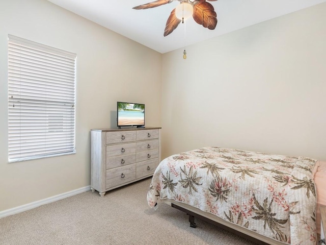 bedroom with light carpet and ceiling fan