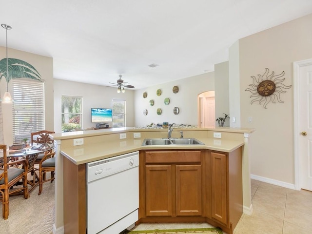 kitchen with sink, a wealth of natural light, dishwasher, and ceiling fan