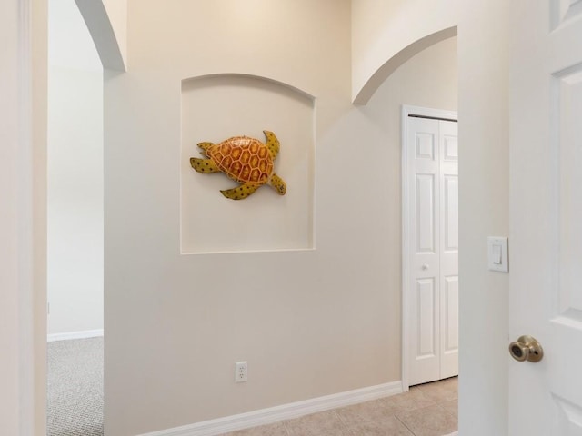 hallway featuring light tile patterned floors