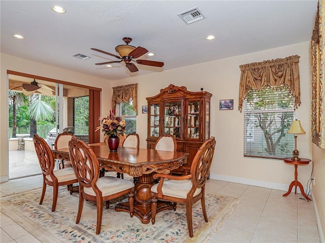 dining space with light tile patterned floors, plenty of natural light, and ceiling fan