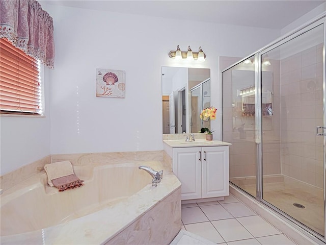 bathroom featuring tile patterned floors, vanity, and separate shower and tub