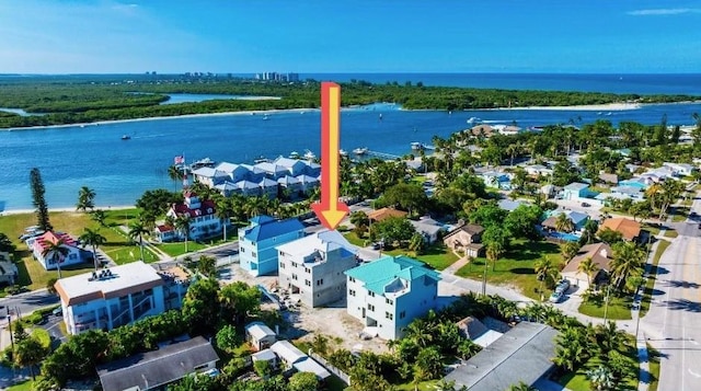 aerial perspective of suburban area with a large body of water