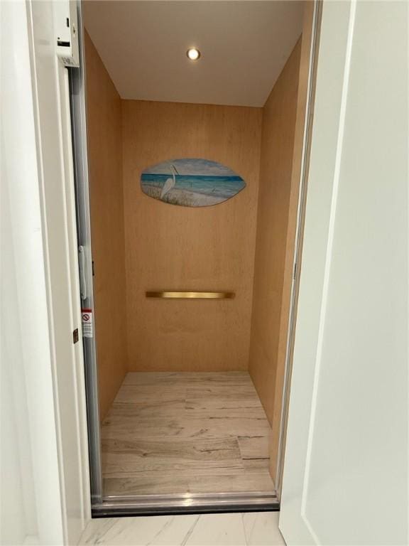 elevator featuring recessed lighting