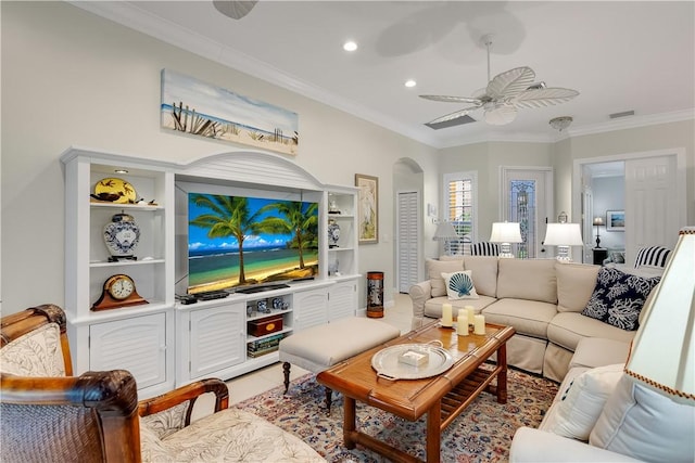 living room featuring ornamental molding, light tile patterned floors, and ceiling fan