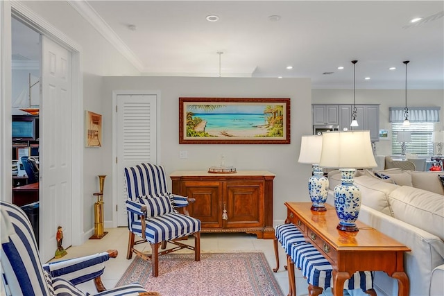 living area featuring crown molding and light tile patterned floors