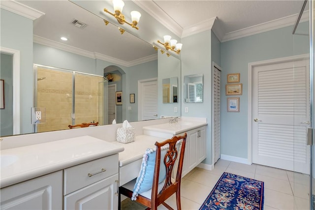 bathroom with tile patterned flooring, ornamental molding, a shower, and vanity