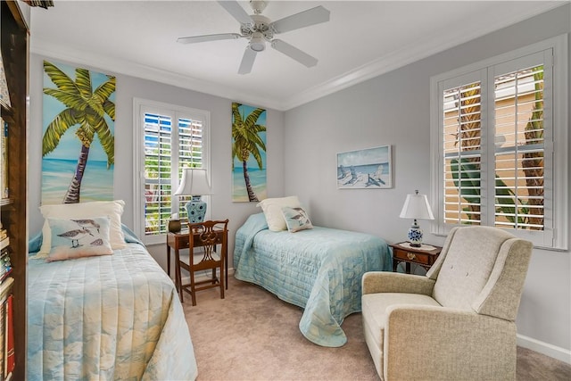 bedroom featuring ornamental molding, light carpet, and ceiling fan