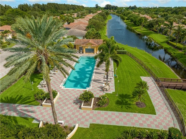 birds eye view of property with a water view