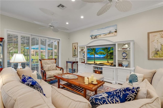 living room with crown molding and ceiling fan