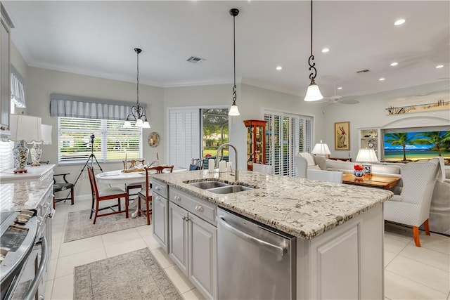 kitchen featuring sink, dishwasher, gray cabinetry, a center island with sink, and decorative light fixtures