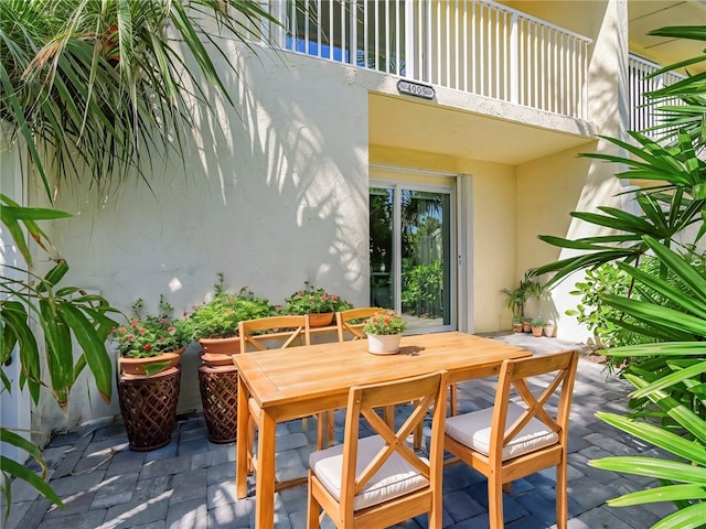 view of patio featuring a balcony