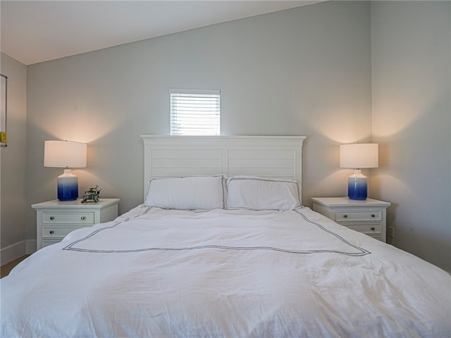 bedroom with lofted ceiling