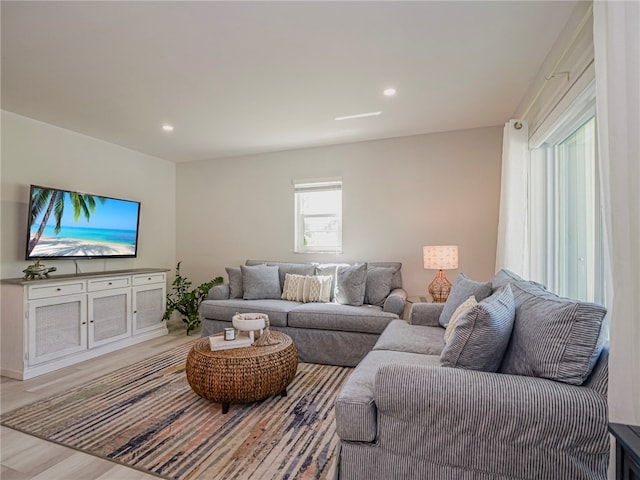 living room with light hardwood / wood-style flooring