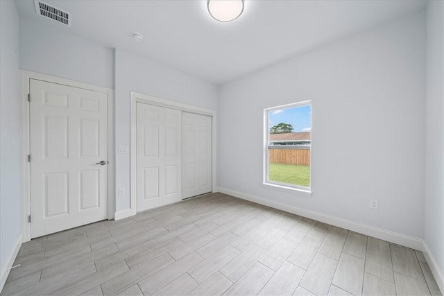 7160 Carlowe Ave, Cocoa, FL 32927 - unfurnished bedroom featuring a closet and light wood-type flooring