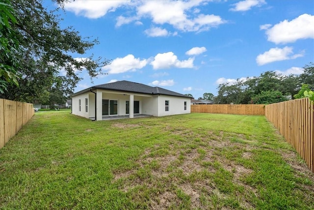 7160 Carlowe Ave, Cocoa, FL 32927 - back of house with stucco siding and a fenced backyard