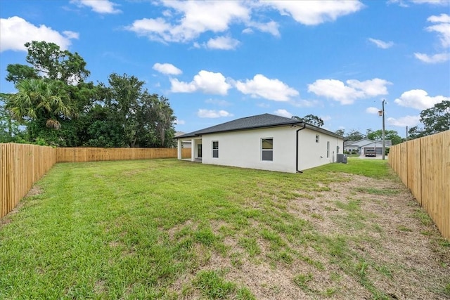 7160 Carlowe Ave, Cocoa, FL 32927 - rear view of house featuring stucco siding and a fenced backyard
