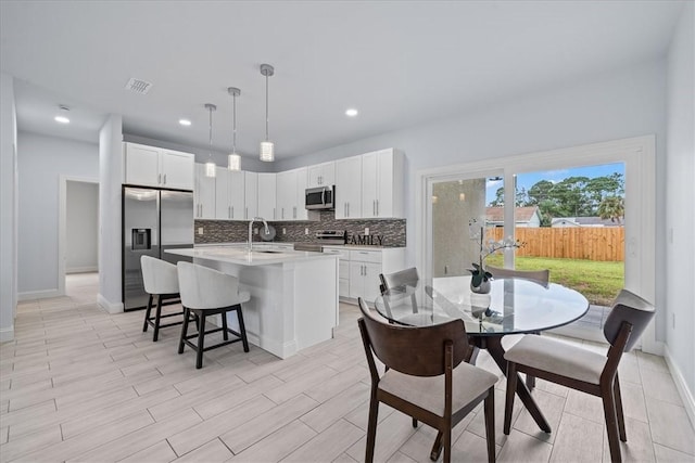7160 Carlowe Ave, Cocoa, FL 32927 - dining space featuring recessed lighting and light wood-style floors