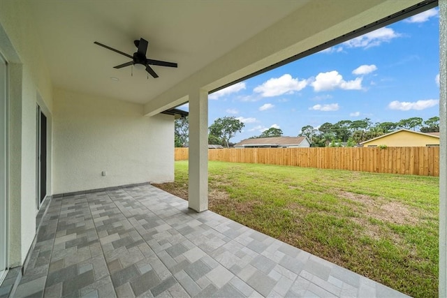 7160 Carlowe Ave, Cocoa, FL 32927 - fenced backyard with a ceiling fan and a patio