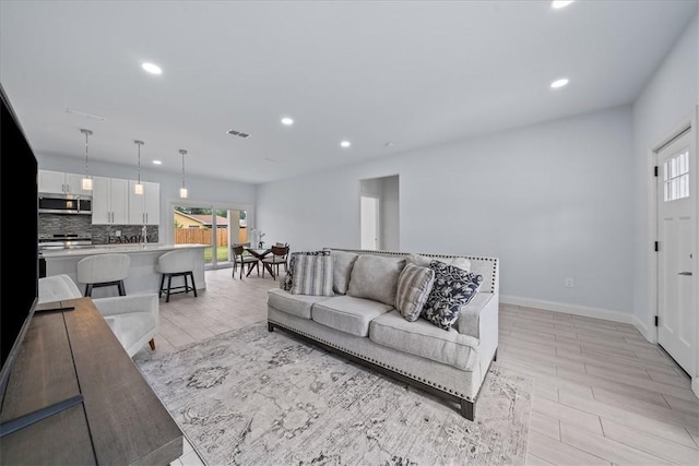 7160 Carlowe Ave, Cocoa, FL 32927 - living room with recessed lighting and wood finish floors