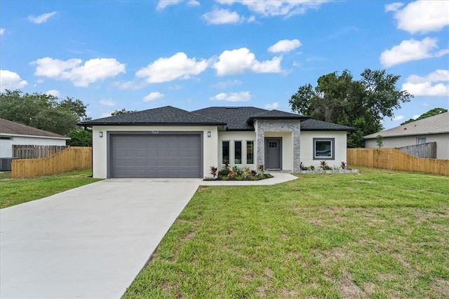 7160 Carlowe Ave, Cocoa, FL 32927 - prairie-style house with stucco siding, an attached garage, and driveway