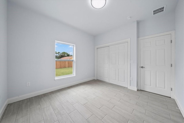 7160 Carlowe Ave, Cocoa, FL 32927 - unfurnished bedroom with a closet and light wood-type flooring