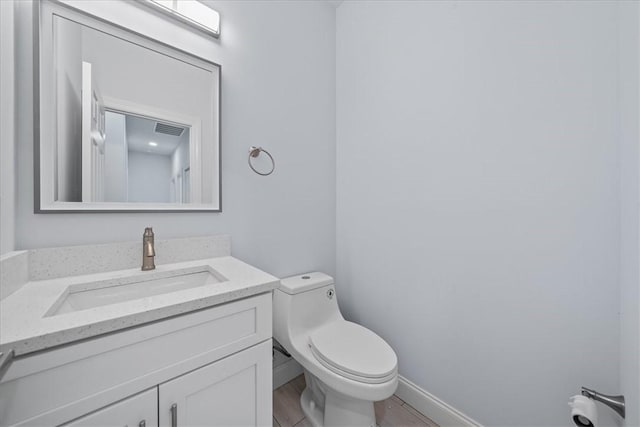 7160 Carlowe Ave, Cocoa, FL 32927 - half bath featuring vanity and wood finished floors