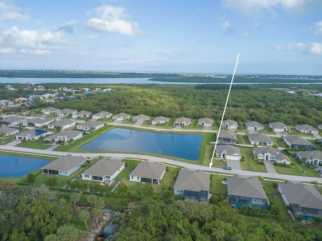 birds eye view of property featuring a water view