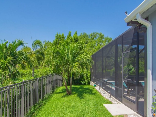 7257 33rd Sq, Vero Beach, FL 32967 - view of yard with glass enclosure, a fenced in pool, and fence private yard