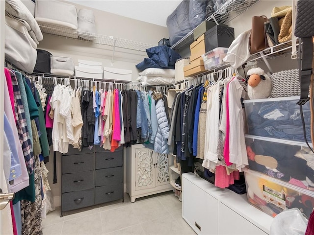 spacious closet with light tile patterned flooring