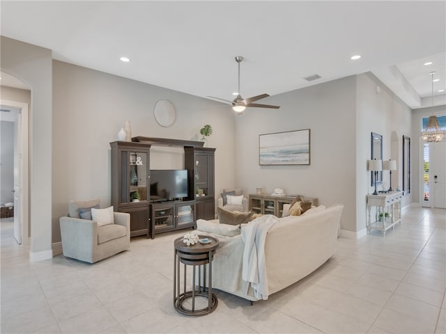 tiled living room featuring ceiling fan