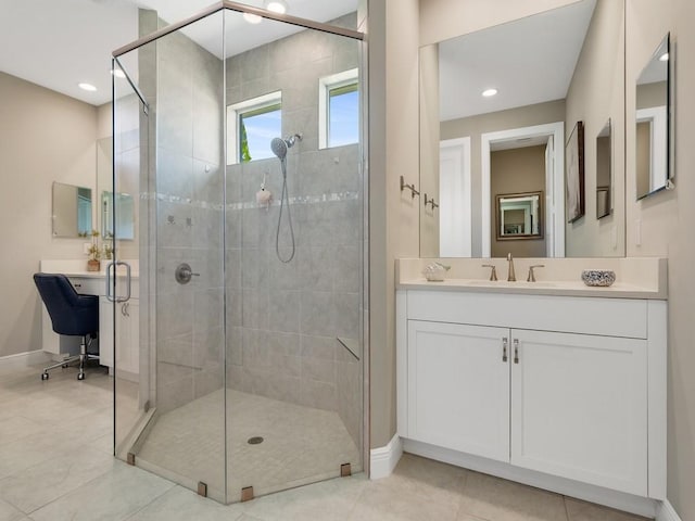 7257 33rd Sq, Vero Beach, FL 32967 - bathroom featuring a stall shower, baseboards, recessed lighting, tile patterned flooring, and vanity