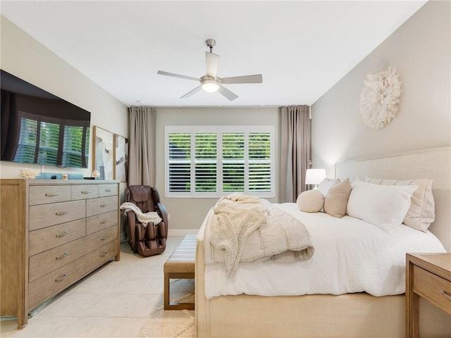 tiled bedroom featuring ceiling fan