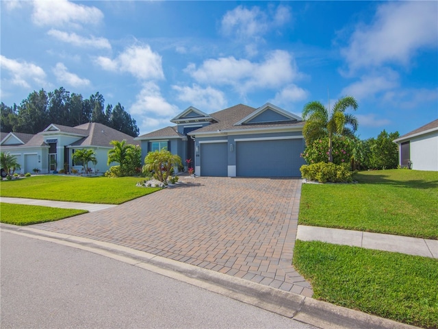 ranch-style home featuring a front lawn and a garage