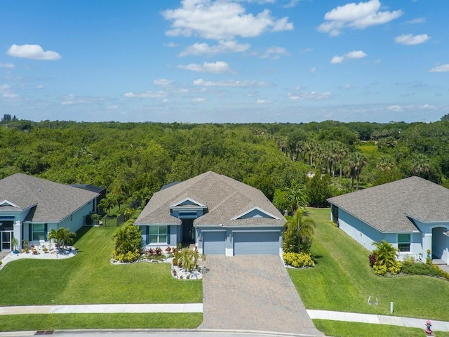 7257 33rd Sq, Vero Beach, FL 32967 - birds eye view of property with a wooded view