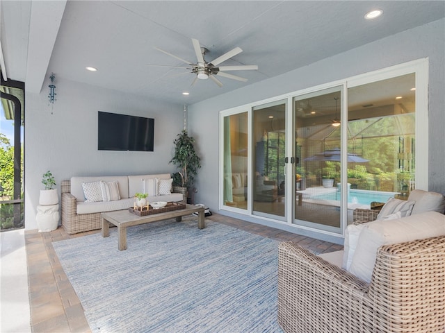 exterior space with outdoor lounge area and ceiling fan