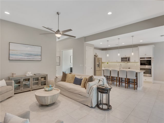 living room with light tile patterned floors and ceiling fan