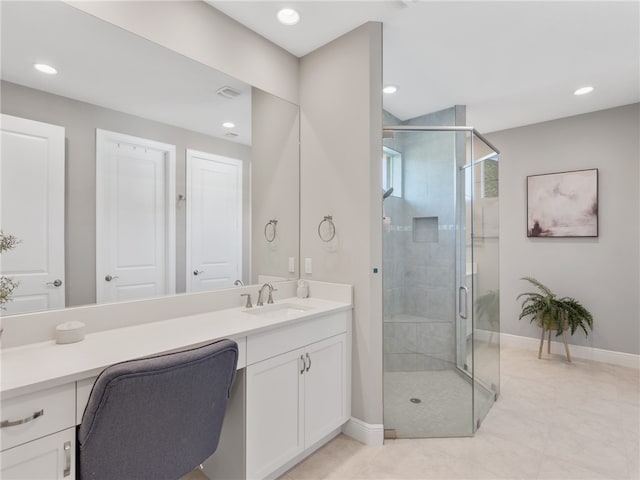 bathroom with walk in shower and vanity