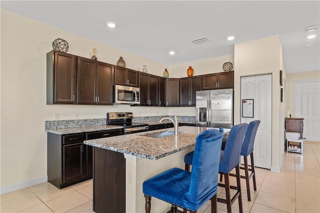10008 W Villa Cir Unit 10008, Vero Beach, FL 32966 - kitchen with light tile patterned flooring, appliances with stainless steel finishes, a sink, and visible vents