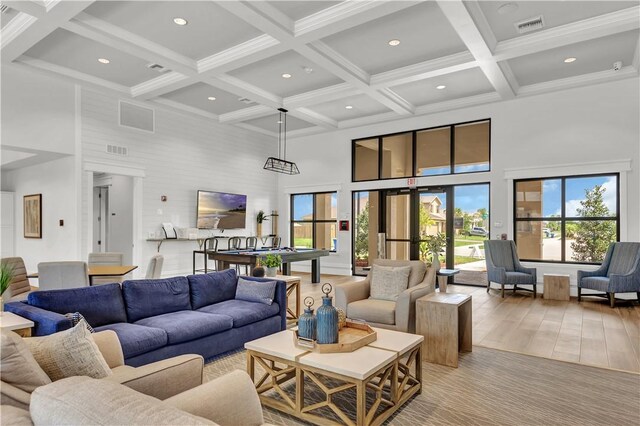 10008 W Villa Cir Unit 10008, Vero Beach, FL 32966 - living area featuring visible vents, a towering ceiling, recessed lighting, plenty of natural light, and coffered ceiling